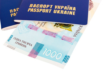 Two Ukrainian passports and one thousand hryvnias, isolated