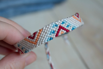 Wall Mural - Group of handmade homemade natural woven bracelets of friendship isolated on white background, close up view