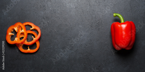 Cuadros en Lienzo Red pepper on a black background