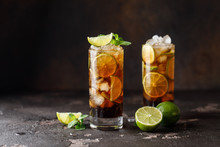 Cuba Libre With Brown Rum, Cola, Mint And Lime. Cuba Libre Or Long Island Iced Tea Cocktail With Strong Drinks