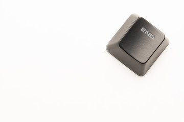 Poster - black keyboard button with a white inscription End in the corner on a white background