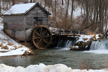 Rural Landscape With Old Abandoned Watermill In Woods. Snowy Winter View Of Obsolete Wooden Mill And Waterfall Between Trees. Travel America, Wisconsin, Midwest USA.