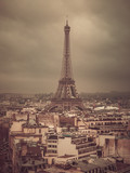 Fototapeta Paryż - Eiffel tower and rooftops, Paris, France, vintage old color photo effect,  view from Arc de Triomphe.