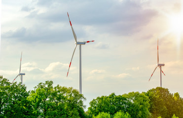 Windmills for electric power production  Wind turbines with power line in the sunset 