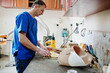 © AS Photo Family - Prosthetist man making orthopedic insoles while working in laboratory.