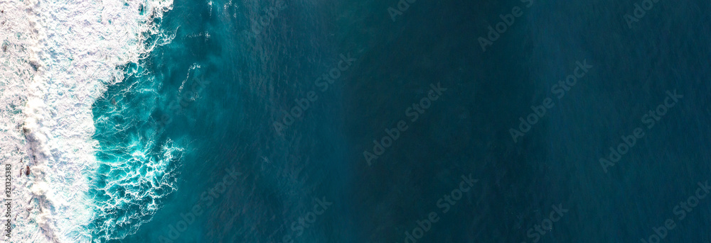 Aerial view to waves in ocean Splashing Waves. - obrazy, fototapety, plakaty 
