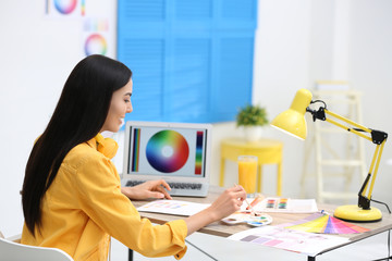 Sticker - Female designer working at desk in office