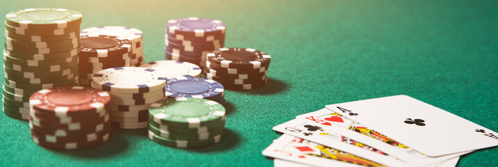 Wall Mural - Poker chips, cards on green table