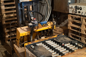 Old forklift, workshop, yellow closeup