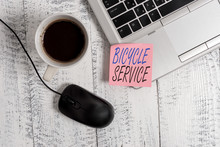 Writing Note Showing Bicycle Service. Business Concept For Offering Services Like Bicycle Rent Or And Maintenance Trendy Metallic Laptop Blank Sticky Note Coffee Cup Mouse Lying Vintage