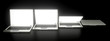 © crevis - Some laptops on black surface with glowing screens - 3D rendering