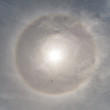 Sun halo seen from Houghs Neck, Quincy, Massachusetts on a partially cloudy day. 