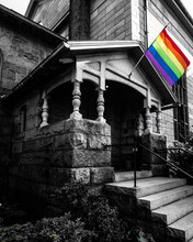 Gay Pride Flag Posted On The Front Doorstep Of The United First Parish Church In Quincy Center. 
