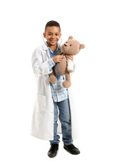 Sticker - Cute little African-American doctor with toy on white background