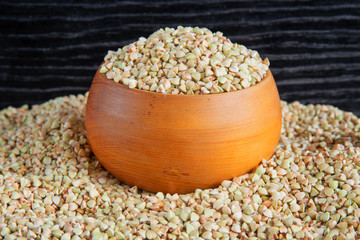 Green buckwheat in wooden bowl