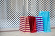 colorful shopping bags is on the floor in the luxury mall close up