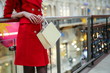 elegant woman is enjoying shopping close up in a luxury mall