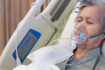 close-up of elderly woman patients with lung disease, getting oxygen for treatment in the room at ho