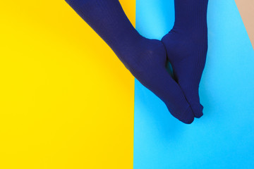 legs in colorful socks on colorful  background - Image