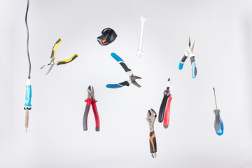 Wall Mural - Set of tools levitating in air isolated on grey