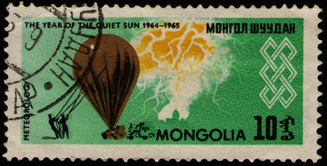 Wall Mural - MONGOLIA - CIRCA 1965: post stamp 10 Mongol mongo printed by Mongolia, shows meteorological probe balloon, people, lightning and emblem, circa 1965