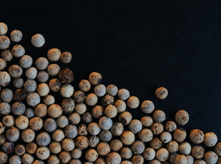 Wall Mural - White peppercorn on black floor