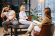 © Roman - married couple upset and aggrieved with atmosphere in their family, man and woman want to solve problems, no to get divorced that is why they visit professional psychologist. isolated in modern office