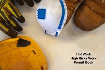 Wall Mural - safe workplace tope picture of hot work high risk work permit book with defocused personal protectiv