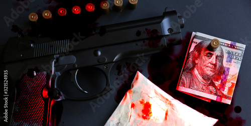 Gun with bullets lying on the table. Criminal problems. Drugs and money on black background. Illegal selling.