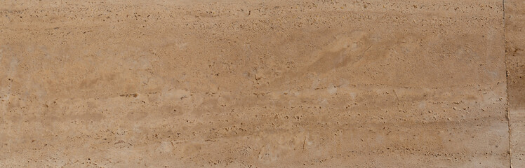 Yellow limestone tiles pool surface closeup texture background.