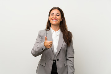 Wall Mural - Young business woman over isolated white background giving a thumbs up gesture