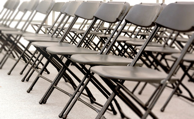 a group of black folding chairs