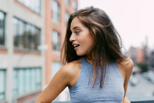 USA, New York City, Brunette Young Woman Turning Away