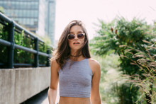 USA, New York City, Brunette Young Woman Wearing Sunglasses