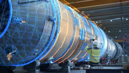 Wall Mural - AR Concept: Industrial Engineer Uses Augmented Reality Digital Tablet to Scan Large Metal Construction, Special Effects Show Visualization / Digitalization of Oil, Gas and Fuel Transport Pipeline.