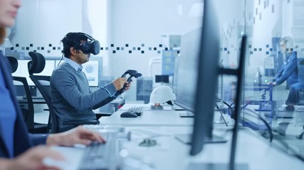 Aufkleber - Modern Industrial Factory: Mechanical Engineer Wearing Virtual Reality Headset, Holding Controllers, Uses VR technology for Industrial Design, Development and Prototyping in CAD Software on Computer.