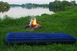 summer vacation by the river with fire and air mattress