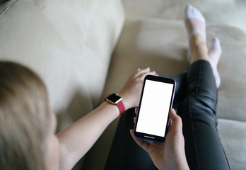 Gelendzhik, Russia -   January 26, 2020: Hands of an woman use Iphone 11. Mock up image blank white screen cell phone. Men manual texting using mobile background empty ad space.Apple watch on hand.