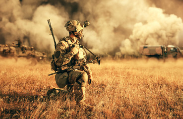 Military troops and machines on the way to the battlefield in farm.