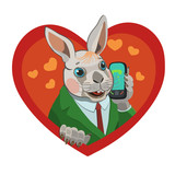 Fototapeta Konie - The rabbit calls the mobile phone, he loves it, loves it happy and satisfied with his life!