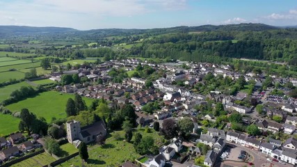 Wall Mural - 4K aerial footage of a pan from right to left over the beautiful town of Usk in Gwent, South Wales