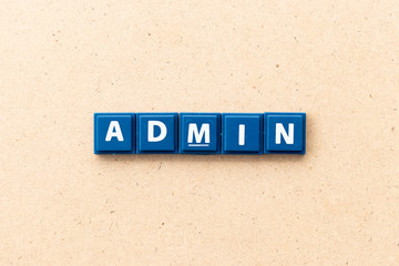 Tile letter in word admin on wood background