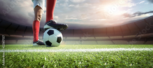 Fotomural football player in the stadium