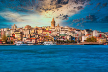 Galata Tower In Istanbul City Of Turkey. View Of The Istanbul City Of Turkey With Bosphorus, Seagulls And Boats At Bright Sky And Sunset Or Night. 	