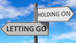 Letting go and holding on as a choice, pictured as words Letting go, holding on on road signs to show that when a person makes decision he can choose either option, 3d illustration