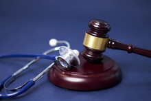 Stethoscope And Judgement Hammer. Gavel And Stethoscope. Medical Jurisprudence. Legal Definition Of Medical Malpractice. Attorney. Common Errors Doctors, Nurses And Hospitals Make.