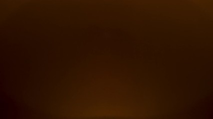 Wall Mural - warm light effect in studio over black background