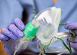 Nurse prepares oxygen mask in a hospital, conceptual image