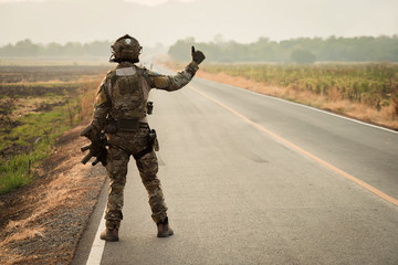 Wall Mural - Soldier with machine gun patrolling 