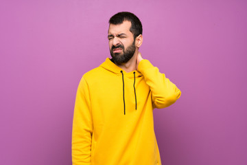 Wall Mural - Handsome man with yellow sweatshirt with neckache